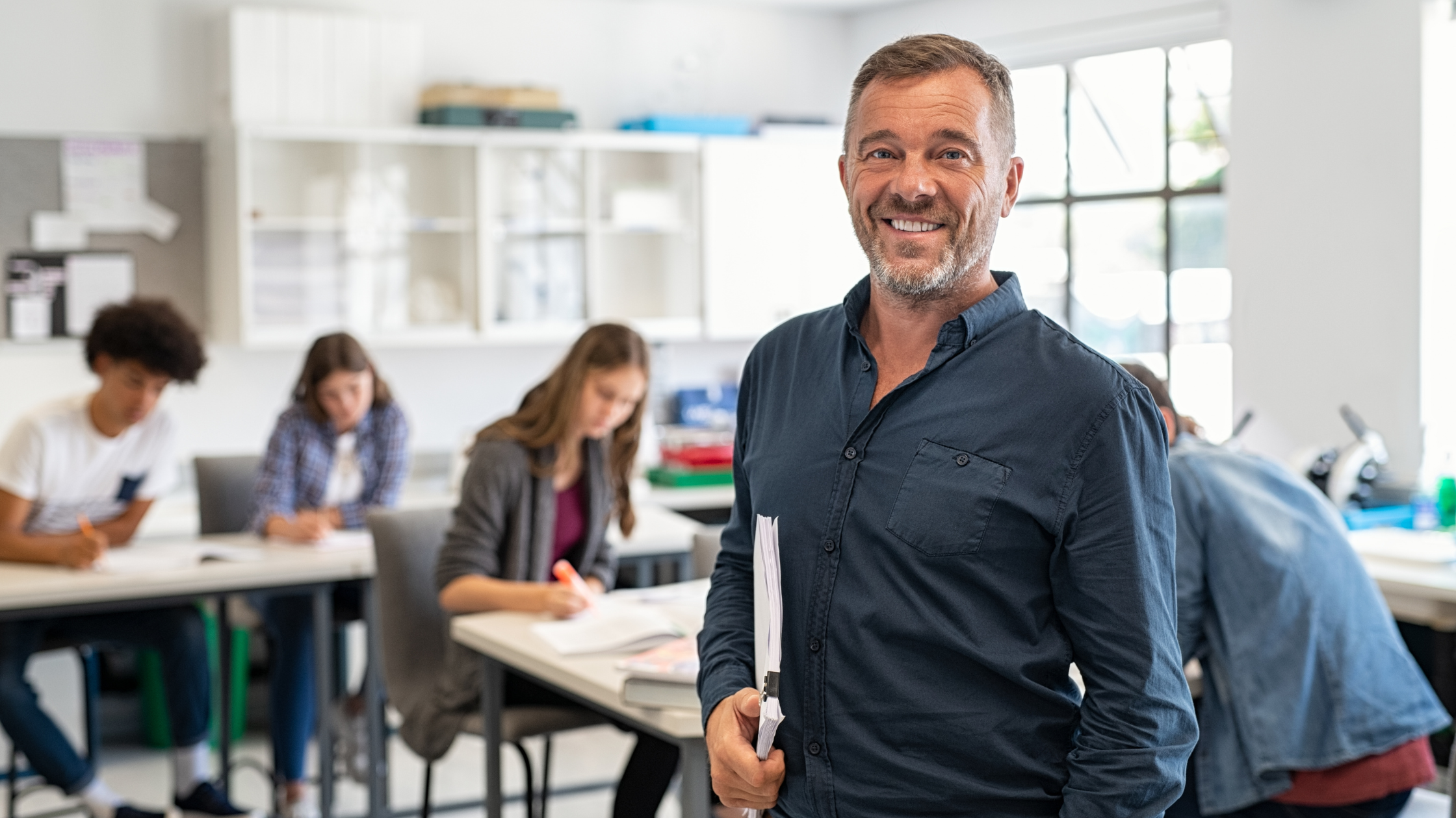 Teacher smiling in a classroom